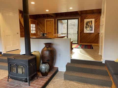 View to upper dining area and kitchen
