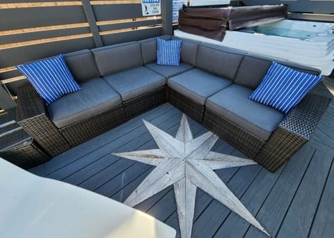 Hot Tub & Outdoor sectional on deck featuring built in Cypress Nautical Stars