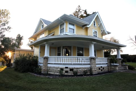 Wrap around porch.  Notice the curved window.