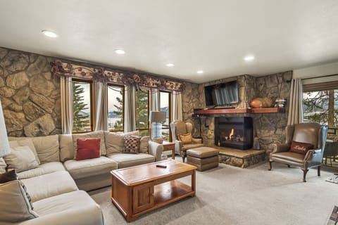 Relax in our cozy Living Room with fireplace and beautiful views of Lake Dillon