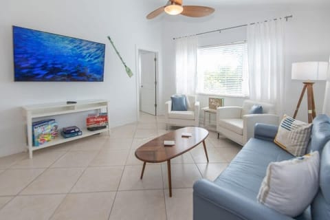Enjoy movies in our welcoming living room with your crew on our 65" HD Smart TV. Spread out with our pullout sofa and Queen size air mattress #livingroomgoals #interiordesign #homedecor ️