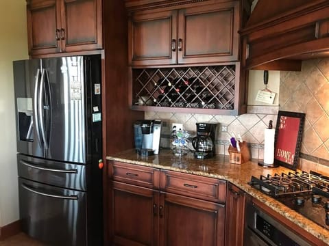 Kitchen - wine rack and french door refrigerator and drawer freezer.