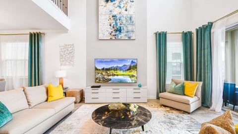 Enjoy quality time with loved ones in our inviting living room, offering a cozy space for relaxation.
