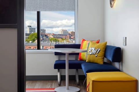 Sip coffee by the window on a cozy lounge banquette.