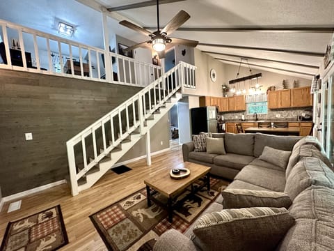 Vaulted ceiling great room overlooking the game room loft