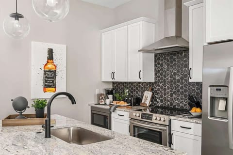 Fully stocked kitchen with island for prep and dining
