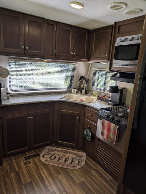 Kitchen with full size fridge, gas stove/oven, microwave & K-cup coffee maker