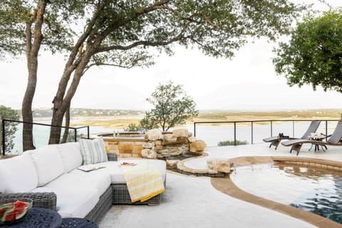 Heated pool and hot tub with sectional and chaise loungers