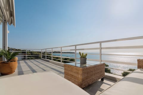 Outside lounge area and balcony with sea views