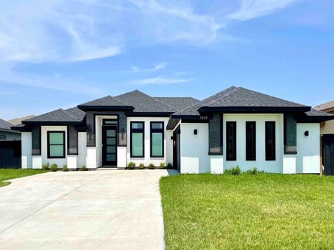 Three bedroom and four full bathrooms house with arcade and pool.
