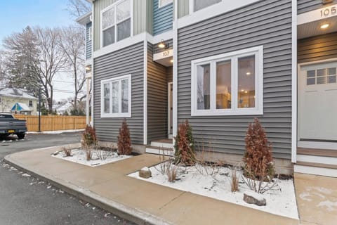 Gray townhome with covered entrance