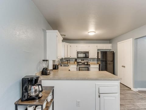 Our kitchen boasts ample space for you to comfortably prepare your meals.