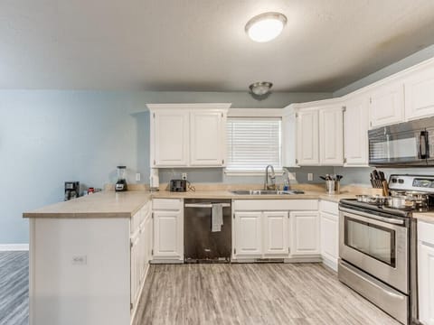Unleash your inner foodie in this inviting and well-equipped kitchen.