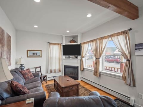 【Living Room】 Gas fireplace crackles on cool Leadville nights — Victorian bones, updated comfort.