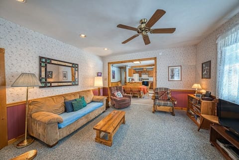 【Living Room】Wood-paneled main room — the family lands here after a Mineral Belt ride