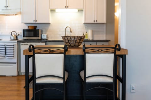 Kitchen island is perfect for watching the cook prepare something delightful