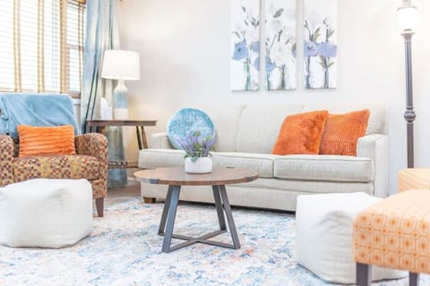 Step into comfort—our vibrant living room is the perfect spot to relax after a day of exploring.