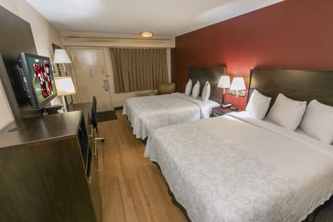 Relax in a bright, open layout with seating and TV.