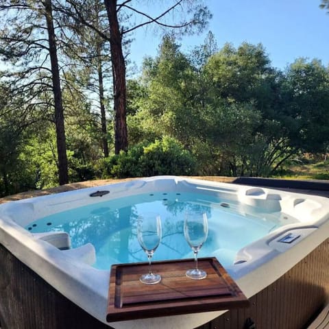 Unwind after a long day, with hot bubbling water and a glass of wine