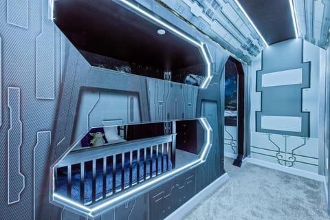 Feel the Force in this Star Wars bedroom! Sleep in a spaceship, bask in LED lights, and marvel at the Millennium Falcon. A galactic stay for Star Wars fans. Book now or miss out! 🌌✨ #StarWarsRetreat #MayTheForceBeWithYou
