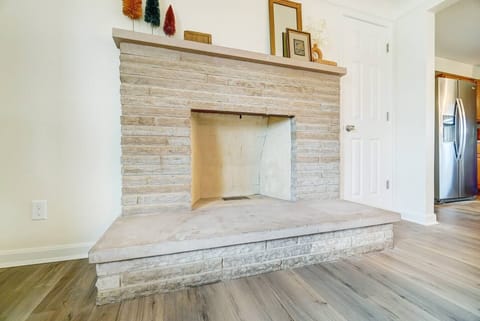 Decorative, non-functional fireplace serves as a gorgeous backdrop for the living room.