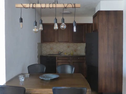 Property, Furniture, Cabinetry, Table, Wood, Lighting, Interior Design, Chair, Countertop, Living Room