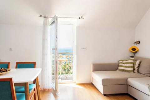 Living- and dining room are connected in the same room with access to a balcony.