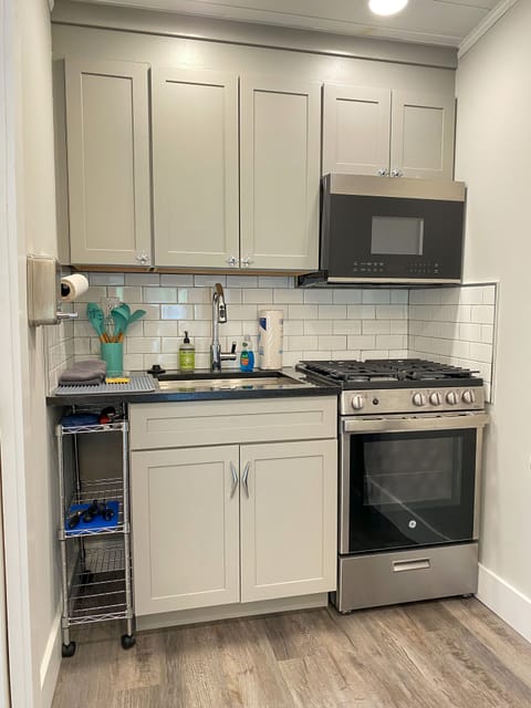 Full kitchen with Gas Stove, full size microwave & the Essentials 