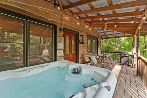 Relax in the hot tub on the back deck while listening to Cavender Creek