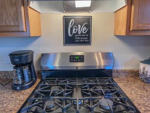 The sign in the kitchen reads "Love grows best in little houses just like this", and we couldn't agree more!