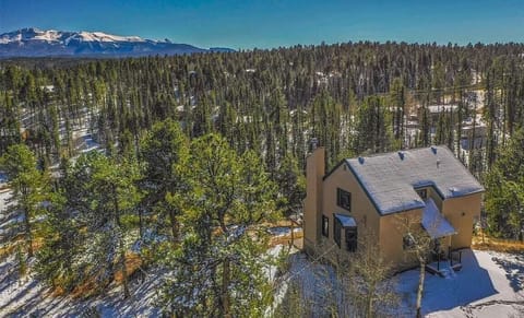 Pikes Peak looms over the cabin.