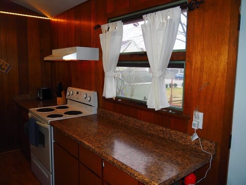 KITCHEN:  Very convenient and functional galley kitchen with all appliances, including a dishwasher.  Includes lots of counter space and a good supply of cooking and dining utensils.