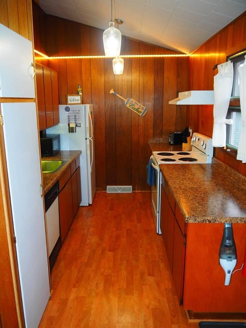 KITCHEN:  Very convenient and functional galley kitchen with all appliances, including a dishwasher.  Includes lots of counter space and a good supply of cooking and dining utensils.