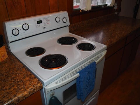 KITCHEN:  Very convenient and functional galley kitchen with all appliances, including a dishwasher.  Includes lots of counter space and a good supply of cooking and dining utensils.