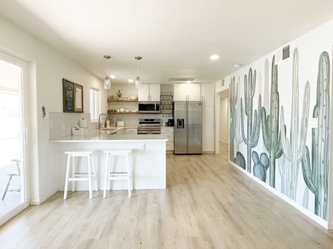 Nicely stocked kitchen- stainless steel appliances and plenty of counter space.