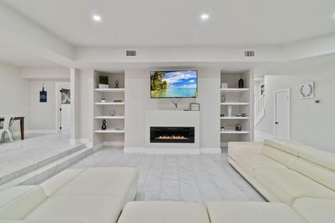 Large Wrap around Couch w/ 55 inch Smart TV