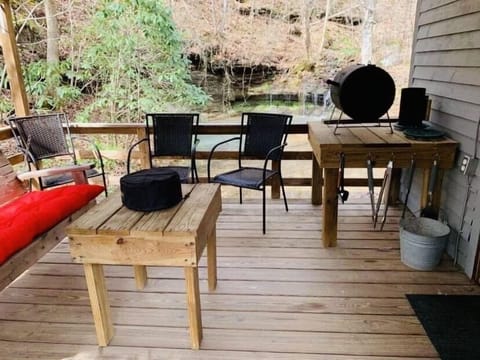 Porch overlooks the small pond. 
 Charcoal grill provided. 
(BYO Charcoal)