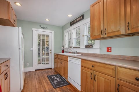 There is a door off of the kitchen leading to the back porch