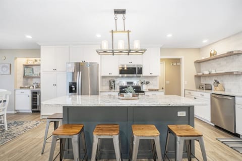 Updated kitchen with gorgeous countertops and a snack bar