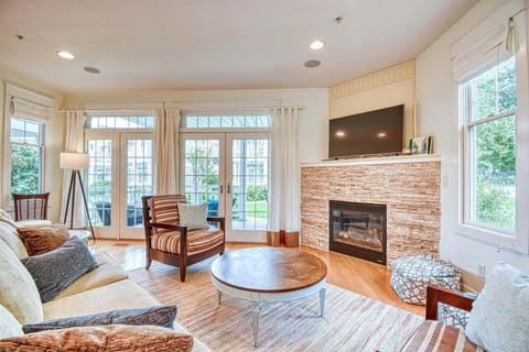 Aqua Essence has a cozy living room with a smart TV and seasonal gas fireplace