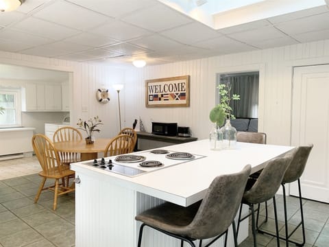 Center work island has a snack bar with seating for four