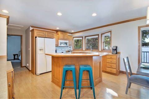 Kitchen has tons of counter space and a snack bar with seating for 2