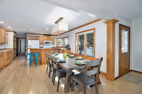 Between the dining table and snack bar, everyone can enjoy a meal together