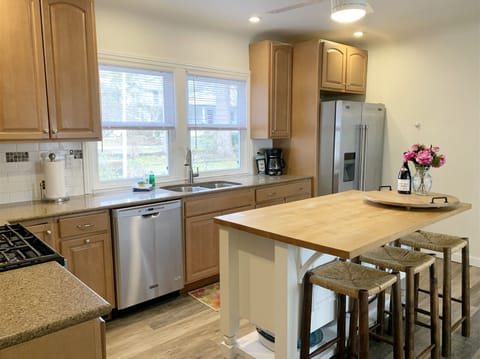 Gorgeous butcher block island and stainless steel appliances