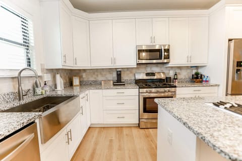 Stainless steel appliances and a farmhouse sink