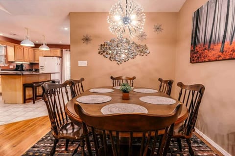 Gather around and savor delicious meals with your group at our spacious dining table, comfortably seating 6 guests, with additional bar seating - the perfect setting for an unforgettable dining experience.