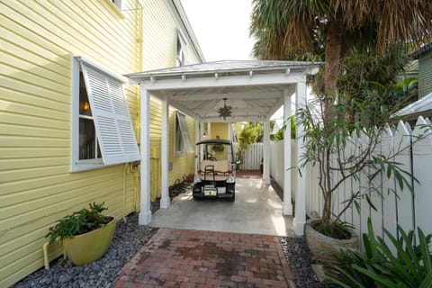 Offsteet parking for two autos or golf carts and bikes fenced