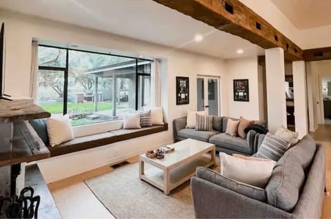 The living room is a warm & inviting area featuring a flat screen TV & Fireplace