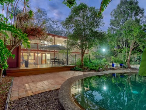 salt water pool and entertainment area with tropical gardens
