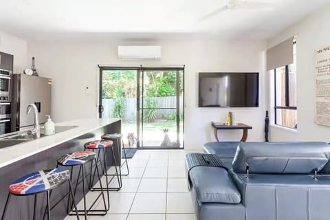 Large kitchen/lounge with 70" Smart TV. Private fully-fenced yard 